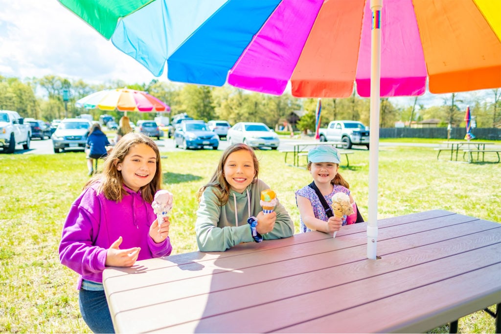 Three kids enjoying ice cream cones