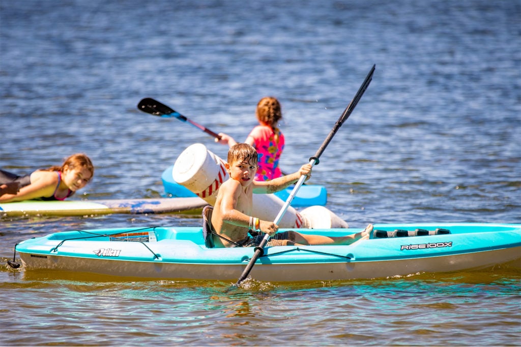 A child kayaking