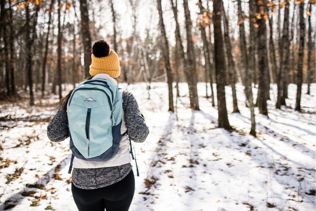 A woman hiking during winter